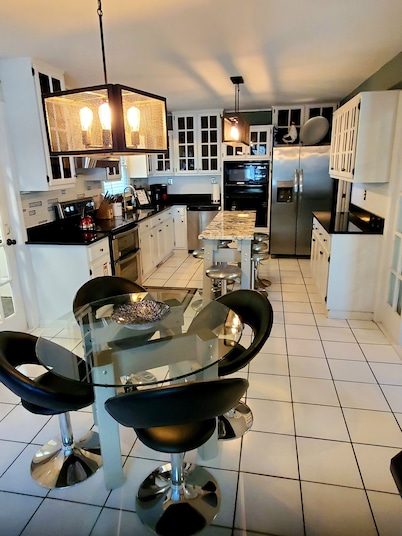 Large custom home with pool centrally located to beaches, parks, and family fun.