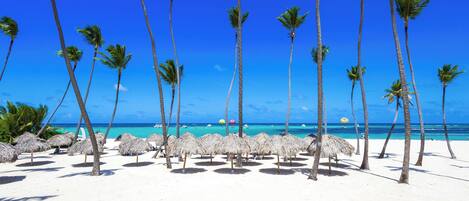 On the beach, sun-loungers, beach towels
