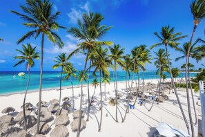 On the beach, sun loungers, beach towels
