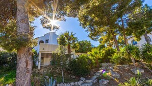 A residential property with a stone staircase leading to a house, surrounded by various trees and plants. - Villa GOOD VIBES by Abahana Villas (Benissa)