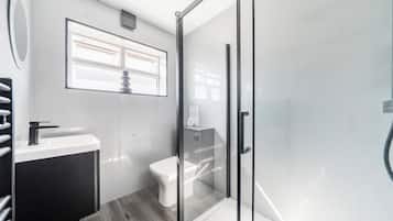 Separate tub and shower, deep soaking tub, hair dryer, towels