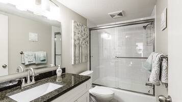Combined shower/bathtub, hair dryer, towels, soap