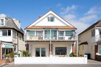 The stylish beachfront home is full of character and charm right on the promenade. Sleeping 19, it's perfect for a large getaway amongst friends or family.