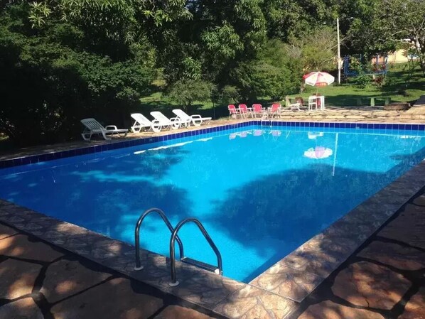 Outdoor pool, open 8:00 AM to 10:00 PM, pool umbrellas, pool loungers
