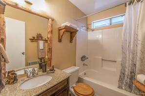 Combined shower/tub, hair dryer, towels, soap
