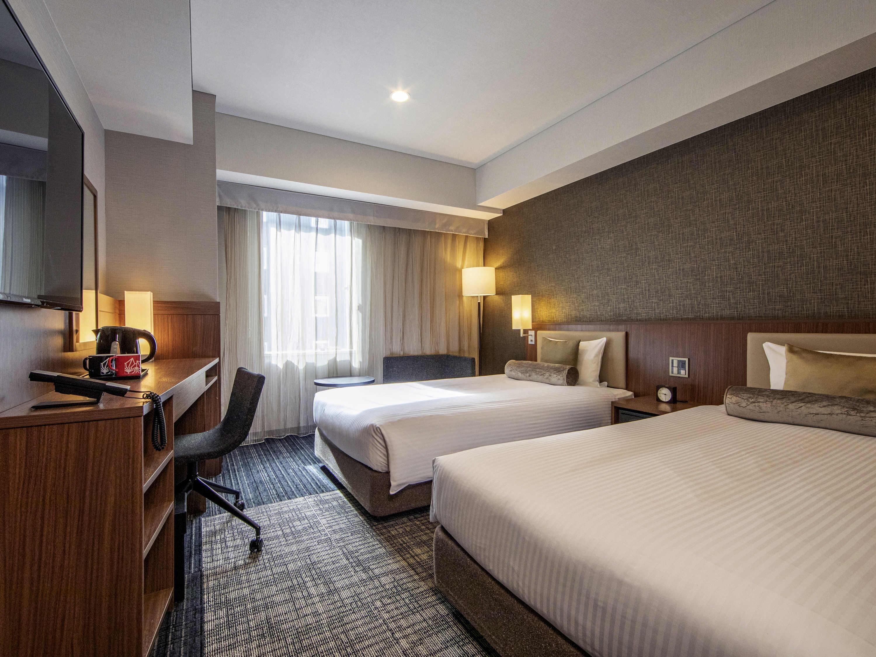 In-room safe, desk, laptop workspace, bed sheets