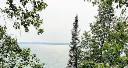 Cozy Hubbard Lake waterfront -beautiful views, private wooded lot, fireplace