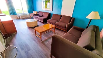 Family Suite, 1 King Bed, Non Smoking, Refrigerator & Microwave | Living area | 32-inch LCD TV with cable channels, TV