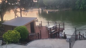Outdoor dining - Lakefront Home with Saltwater Pool, Hot Tub, Firepit, Kayaks.  Pet Friendly (Lexington)