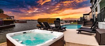 Waterfront villa w/ pool, hot tub, outdoor kitchen.