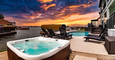 Waterfront villa w/ pool, hot tub, outdoor kitchen.