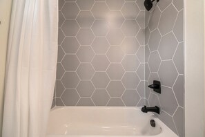 Bathtub, hair dryer, towels