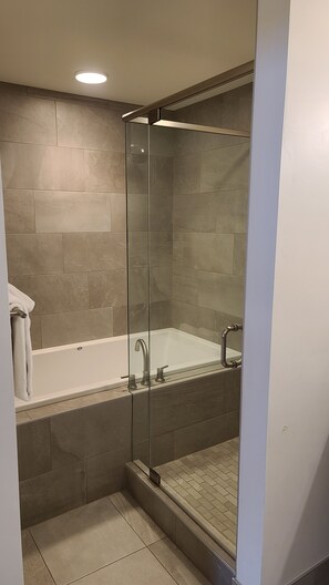 Combined shower/bathtub, towels, soap, toilet paper
