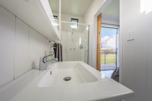 Shower, hair dryer, towels, soap