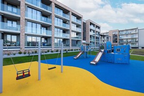 Children’s area - Stylish Apartment | Balcony, Parking and Pool Access (Kolobrzeg)