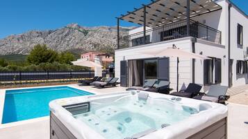 Seasonal outdoor pool, pool umbrellas, pool loungers