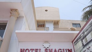 The entrance to Hotel Shagun with a glass door and a sign above it. - HOTEL SHAGUN ROOMS & BANQUET Surat (Surat)