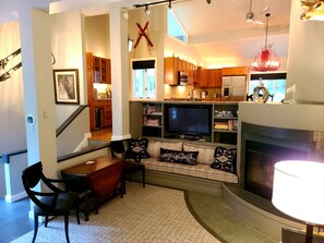 TV, fireplace, books