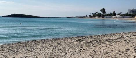 Beach nearby, white sand, 3 beach bars