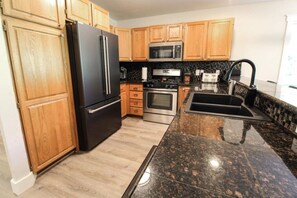 Fridge, coffee/tea maker, cookware/dishes/utensils