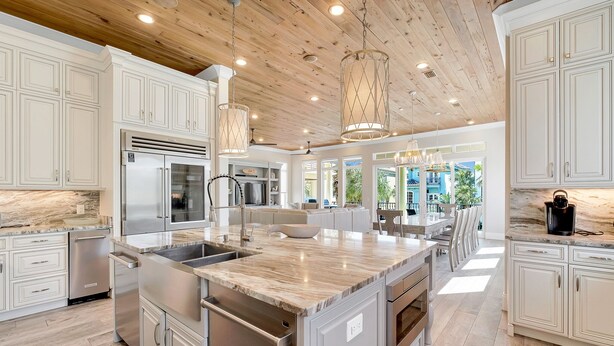 A spacious kitchen with white cabinetry, a large island, stainless steel appliances, and a wooden ceiling. - 7BR Gulf Views, Large Private Pool/Spa, Private Beach/Gated Community, Sleeps 20 (Destin)
