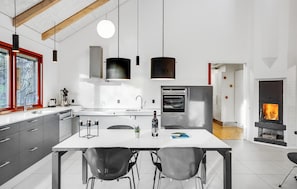 Fridge, dishwasher, coffee/tea maker, cookware/dishes/utensils