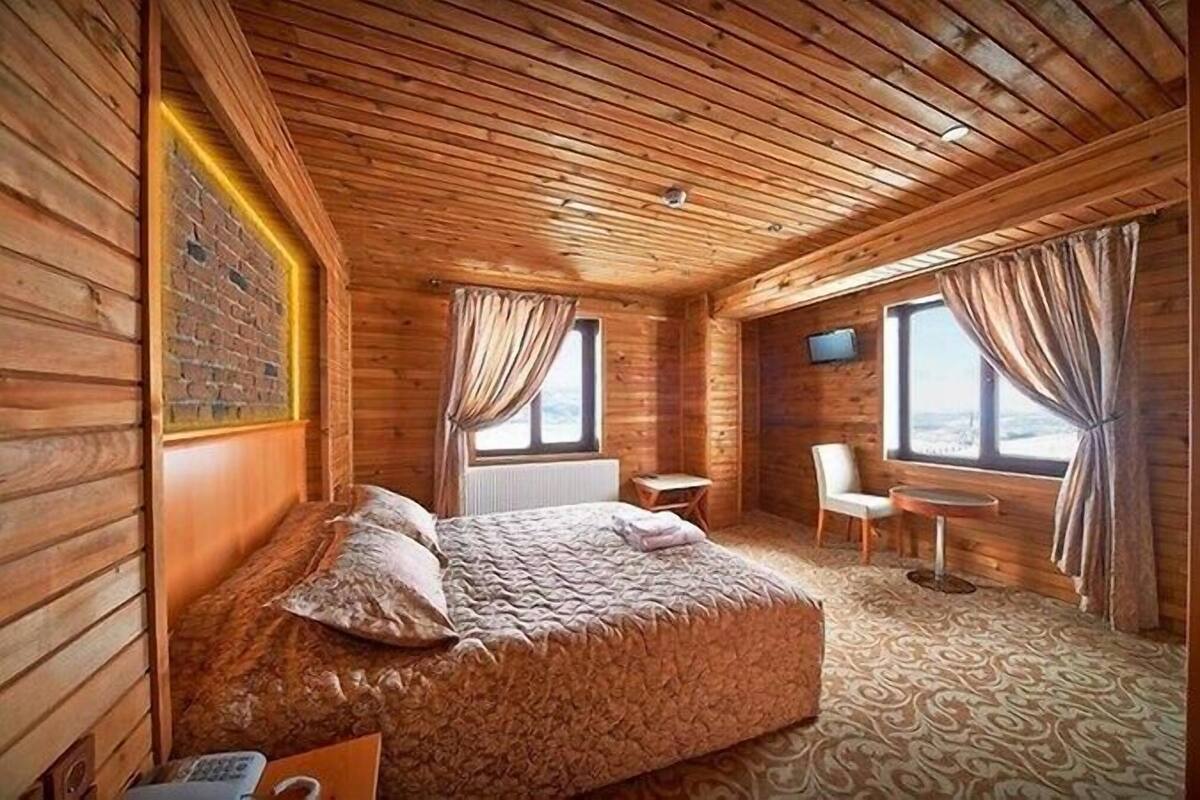 Desk, laptop workspace, bed sheets