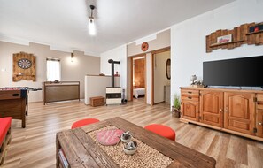 Relax in a well-organized living space with a clear separation between the living area and the bedroom.