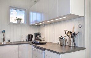 Fridge, microwave, coffee/tea maker, cookware/dishes/utensils