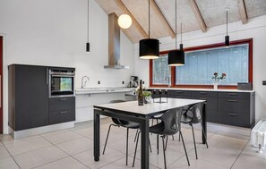 Fridge, dishwasher, coffee/tea maker, cookware/dishes/utensils