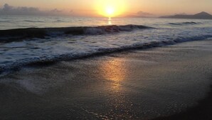 A beach scene with waves and a sunset. - Beachfront  (Yorkeys Knob)