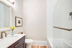 Combined shower/tub, hair dryer, towels, soap