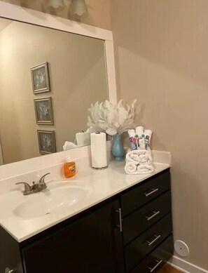 Combined shower/bathtub, hair dryer, towels, soap