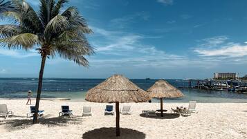 On the beach, sun-loungers, beach towels