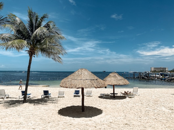 On the beach, sun-loungers, beach towels