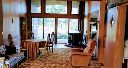 A roomy ,but cozy lodge on 10 acres with trees,private location