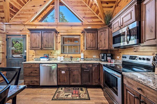 Enjoy cooking in this well-equipped kitchen with a dishwasher, double oven, and microwave.