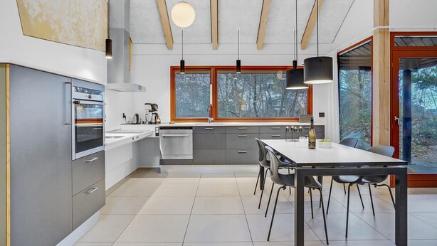 A modern kitchen with a dining area, large windows, and a view of the outdoors. - Awesome home in Grenaa with WiFi (Grenaa)