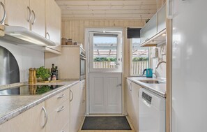 Fridge, stovetop, dishwasher, coffee/tea maker