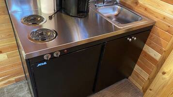 Fridge, microwave, coffee/tea maker, cookware/dishes/utensils