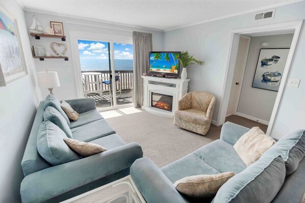 TV, fireplace - Oceanfront getaway with pool. (North Myrtle Beach)