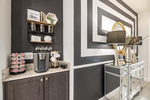 Enjoy a morning pick-me-up at the coffee station, equipped with a coffee maker and a selection of coffee pods.