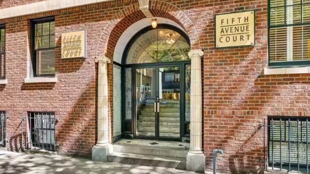 A brick building with a sign reading "Fifth Avenue Court." - Historic 2BR Apt in ❤️ of DT Seattle Free Parking+ (Seattle)