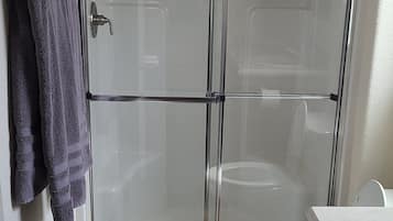 Shower, towels, soap, toilet paper