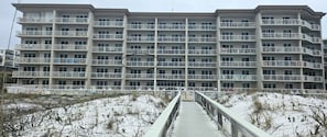 Stunning multi-story building with balconies on each floor, offering a beautiful view.