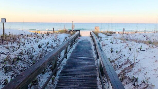 A wooden boardwalk leading to a beach with a clear sky. - Exceptional Luxury Gulf-Front Condo at Summer Place! (Fort Walton Beach)