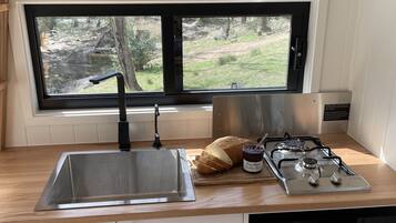 Fridge, microwave, stovetop, coffee/tea maker