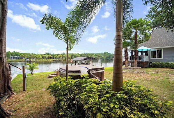 Enjoy serene lake views and relax on the deck with a covered seating area.