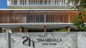 A modern hotel entrance with a marble sign reading "Shambhala Hotel Pattaya." - Shambhala Hotel Pattaya (Pattaya)