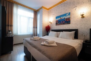 Standaard tweepersoonskamer | Luxe beddengoed, een minibar, individueel gemeubileerd